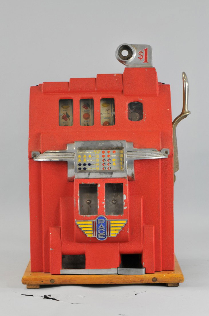 PACE SLOT MACHINE: Twin jackpot machine, painted in red overall, die-cast case oak sides, includes a key. Due to laws regulating the sale of antique slot machines, we as the seller, will not sell to members in the state