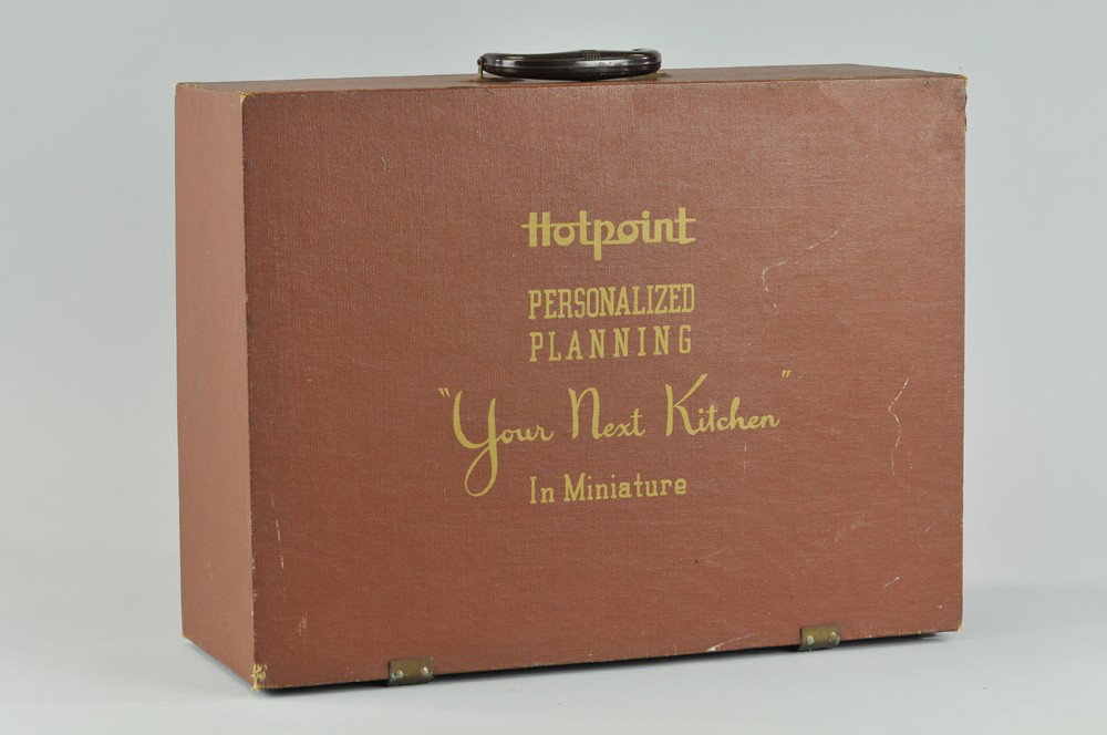 HOTPOINT SALESMAN SAMPLE PLANNER: Interesting briefcase containing plastic kitchen appliances for Hotpoint set-ups, customer could plan and design their kitchen of dreams by placing floor plan with individual pieces. 15 3/4" x 20 3/4"