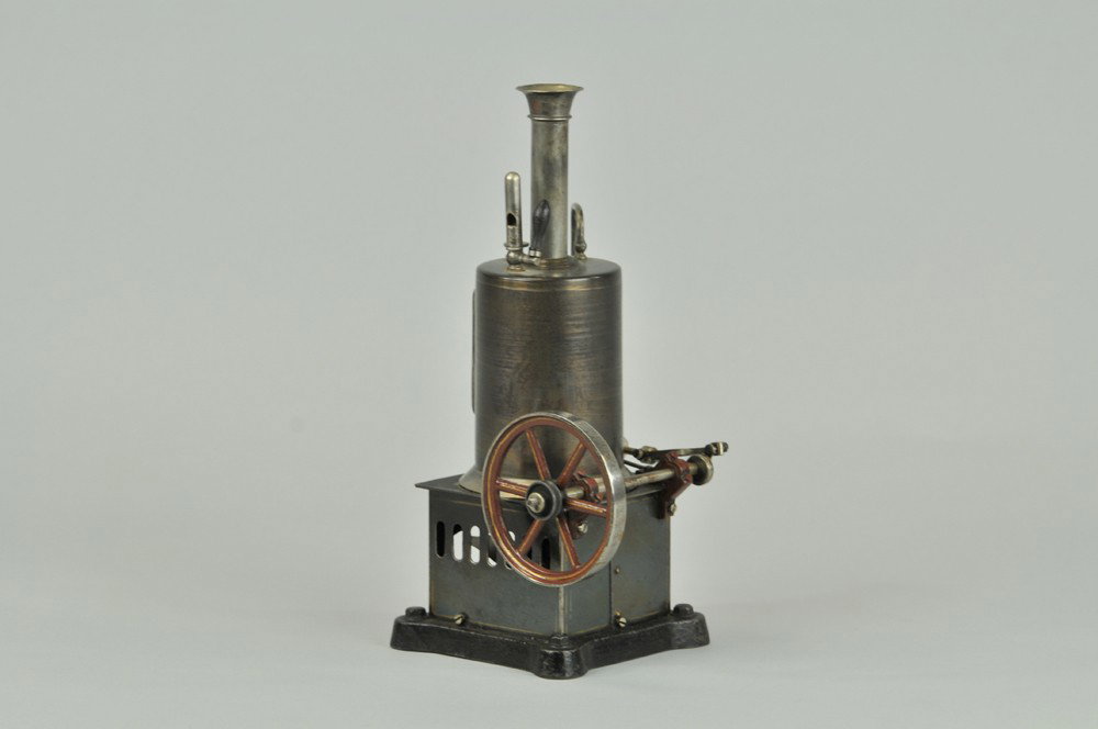 VERTICAL STEAM ENGINE: Polished boiler, unusual square fire box, sight glass, single cylinder, cast flywheel painted in brown, whistle and valve, includes spirit burner. 9 1/2" h. (VG Cond) 9 1/2" h.