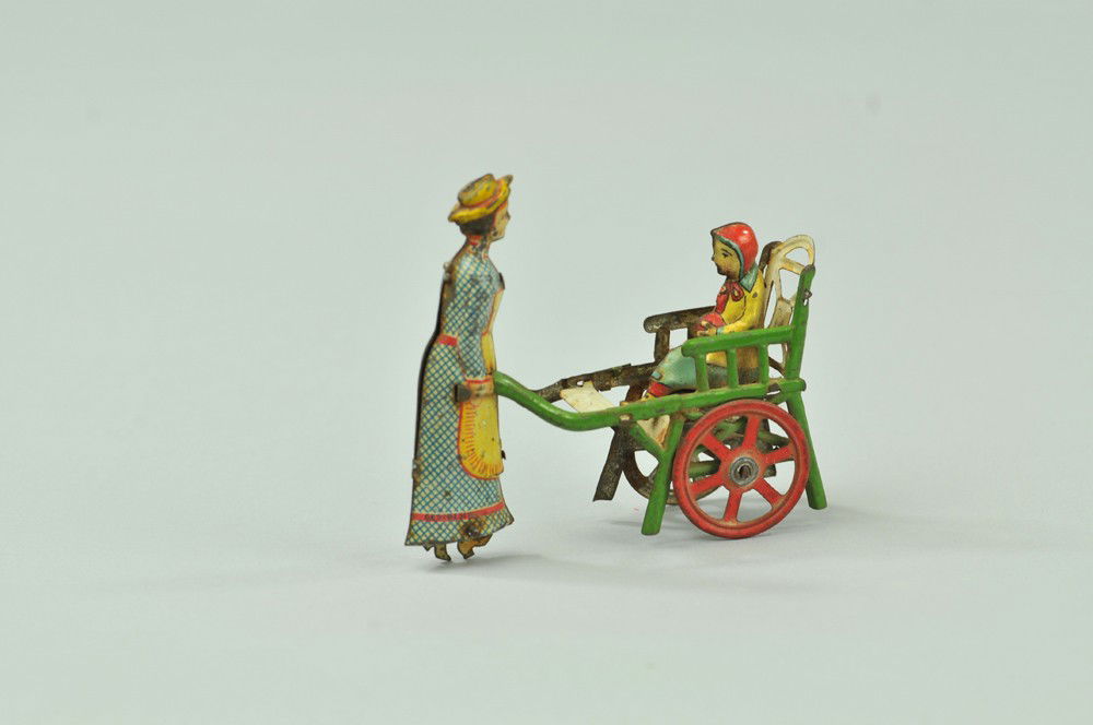 NANNY WITH CHILD PENNY TOY: Meier, Germany, interesting toy depicts nanny pushing child in wheeled high chair, die-cut feet on wheel underneath dress gives impression of walking motion. 3 1/4" l. Minor surface wear. (Exc. Cond.)