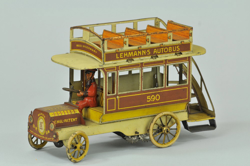 LEHMANN AUTOBUS: Germany, brown lithographed version, double decker bus with open bench upper deck seating, rear stairway, seated driver, clockwork driven. 7" l. (Exc. Cond) 7" l.