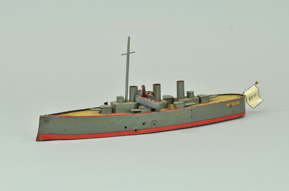 LEHMANN "EMDEN" WARSHIP: Germany, lithographed tin, well detailed deck contains guns, clockwork driven, based on Indian Ocean campaign. 13 1/2" l. Lifeboats and flag are replacements, one crane has broken tip, not working. 13