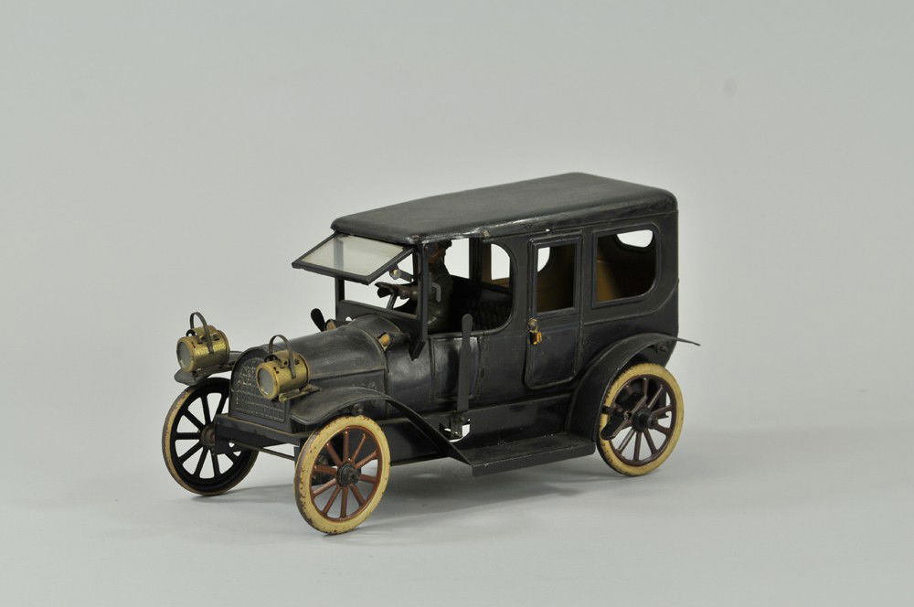 KARL BUB LIMOUSINE: Germany, c. 1912, lithographed tin, done in blue body, black roof, light blue trim surrounds body, true luxury model with folding front windshield and front headlights, seated driver, spoke wheels, cl