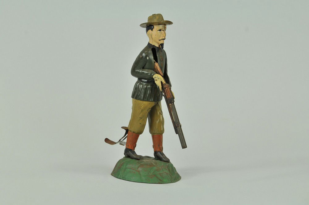 BUFFALO BILL TARGET SHOOTER: Gunthermann, Germany, hand painted tin, depicts famed Buffalo Bill with rifle in hand, lever action, originally sold as "Le Champion". 9" h. Paint wear to rear pull lever, overall (Exc. Cond) 9" h.
