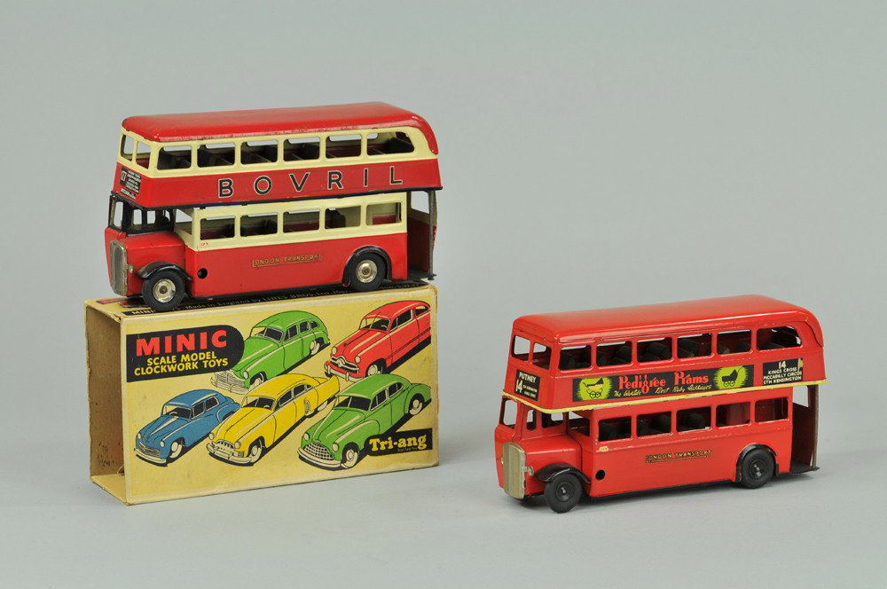 LOT OF TWO TRIANG DOUBLE DECKER BUSES: Both tin with enclosed upper deck seating, one advertises Pedigree Dolls and Pets, and one reads Bovril on sides, includes one box with torn flap. 7" l. Buses (Exc. Cond) 7" l.