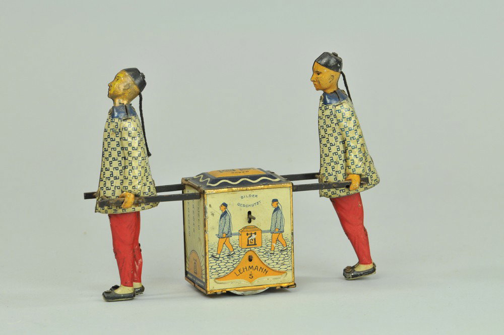 LEHMANN KADI: Germany, lithographed and hand-painted tin, friction mechanism, depicts two Chinese figures hauling colorful tea chest. 7" l. (Exc. Cond) 7" l.