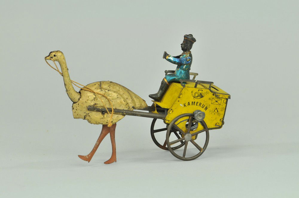 LEHMANN "KAMERUN" OSTRICH CART: Germany, hand-painted and lithographed tin, seated figure attempts to ride open cart drawn by ostrich, clockwork driven, slot in rear of cart. 7 1/2" l. Repair to wheels, wear to litho. (VG Cond) 7 1/