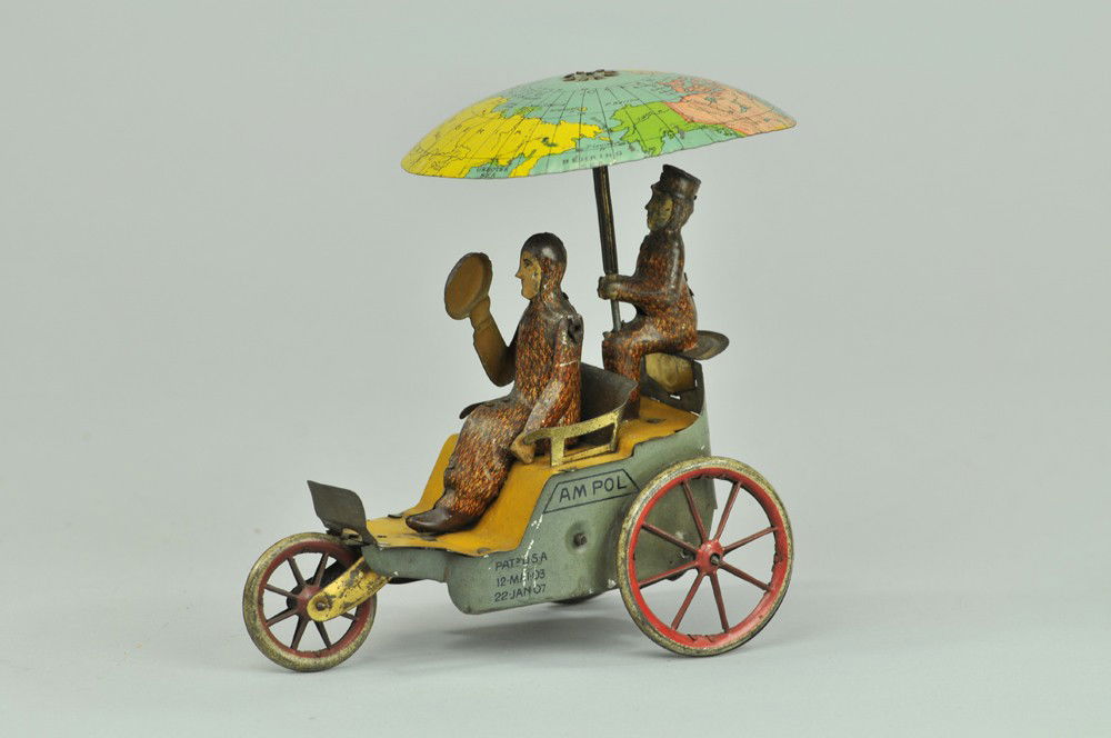 LEHMANN AM POL: Germany, lithographed and hand-painted tin, dark blue sides, red spokes, depiction of Explorer Robert E. Peary dressed in fur coat, as is his companion, Hensley, seated on rear seat holding umbrella w