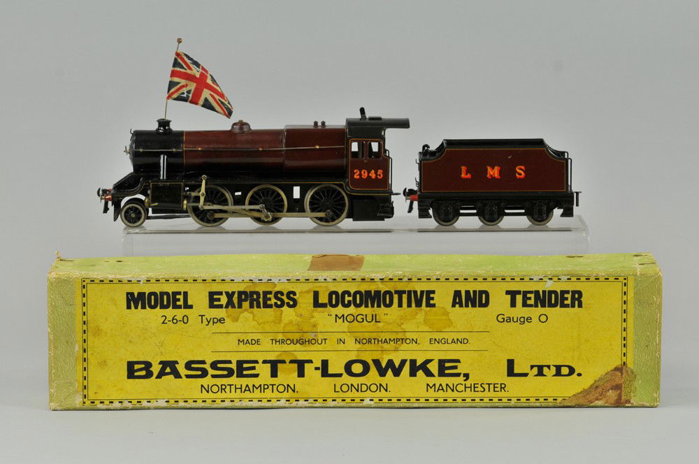 BASSETT-LOWKE BOXED "MOGUL" LIVE STEAM LOCOMOTIVE: "O" gauge No. 2945 loco with LMS tender, both done in rich maroon color, gold decals. 17 1/2" l. Some wear to box and tape on sides. Train - (Exc. Cond) 17 1/2" l.