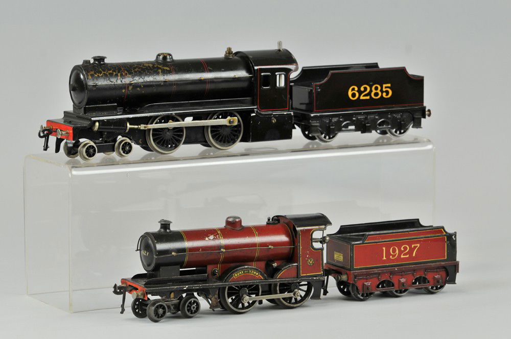 LOT OF TWO BASSETT LOWKE LOCOMOTIVES: Both with tenders, "O" gauge, includes 4-4-0 Duke of York with 1927 tender and 4-4-0 live steam loco with 6285 tender. 5 1/4" l. Wear to paint on steam boiler. Overall (Good Cond) 5 1/4" l.
