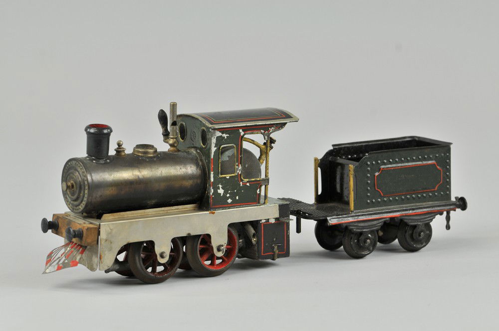ERNST PLANK "O" GAUGE STEAM LOCOMOTIVE AND TENDER: Germany, 0-4-0 locomotive, early example, painted cab and tender, nickeled side frame. 4 1/2" l. Missing dome top, some wear to paint. (VG Cond) 4 1/2" l.