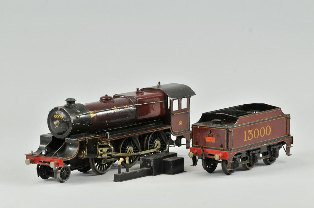 BASSETTE-LOWKE GAUGE "1" STEAM LOCOMOTIVE: 2-6-0 impressively scaled locomotive and six wheel tender marked "13000", includes original bottom half of box. 8" l. Denting to boiler, overall (VG Cond) 8" l.