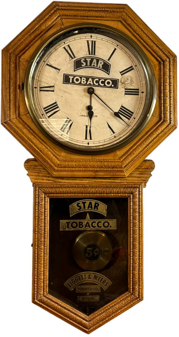 STAR TOBACCO CLOCK: 367. STAR TOBACCO CLOCK | Includes key. | 35" x 18" | Working, glass face is loose, crack in paper dial, otherwise (Excellent Condition) | $600 - $800