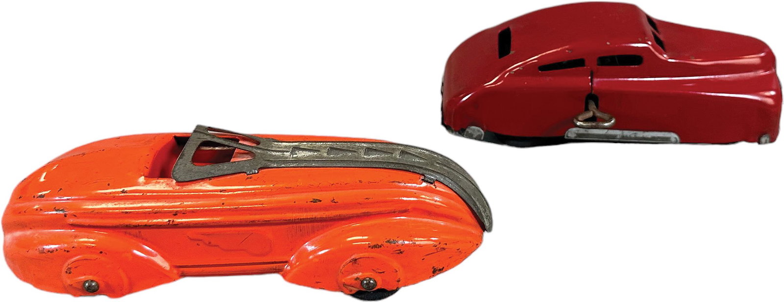 TWO PRESSED STEEL MARX CARS: 1422. TWO PRESSED STEEL MARX CARS | One with wind-up motor. | 7" l. | (Excellent Condition) | $100 - $200