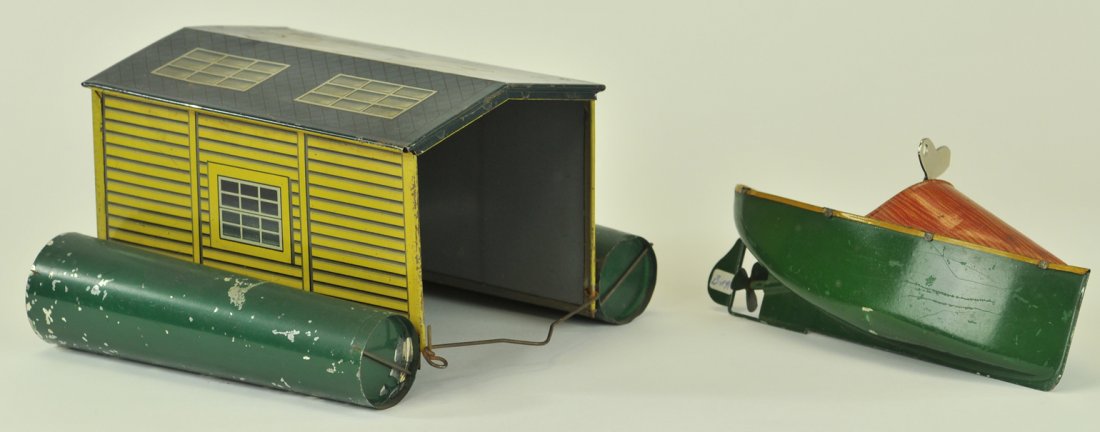 BING BOATHOUSE WITH SPEEDBOAT: Germany, c.1920's, unusual and scarce boathouse with pontoons for floatation, comes with clockwork speed are in green hull and natural wood look tin lithography. 6" boat.
