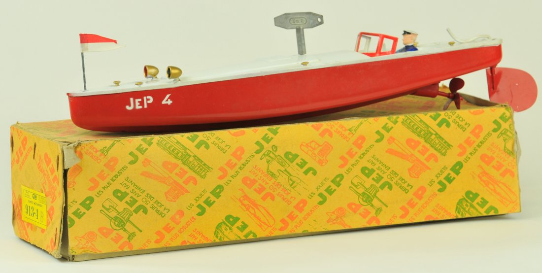 JEP SPEED BOAT WITH BOX: #913-4 France, c.1950's, heavy tin plate, done in red hull, white deck, seated pilot very streamlined example with strong clockwork action. 16" long.