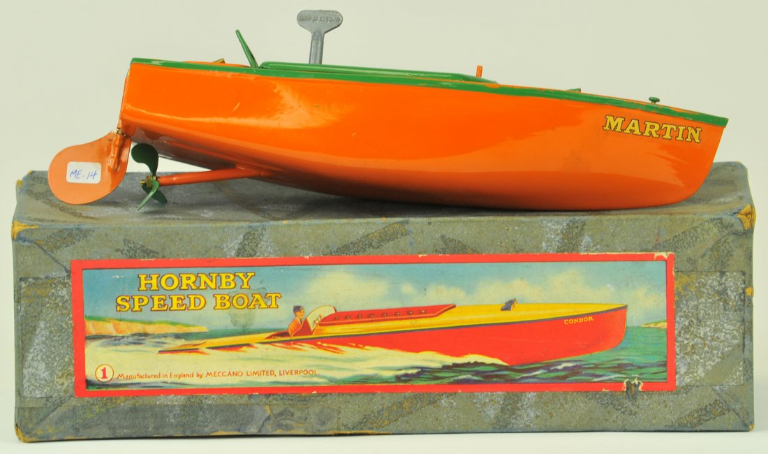 HORNBY BOXED SPEED BOAT: England, No. 1 speed boat, pressed steel, painted in very colorful orangey and green hatch cover and trim, clockwork driven, stenciled at bow. 13" long.