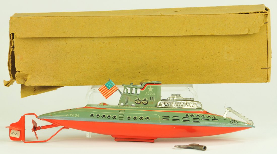 ARNOLD SUBMARINE: #2004 Germany, lithographed tin, includes box, extensive graphic detail, clockwork mechanism accessed through screw cap at conn, gun and railing on deck, flag at railed deck, these were sold at FAO Sc