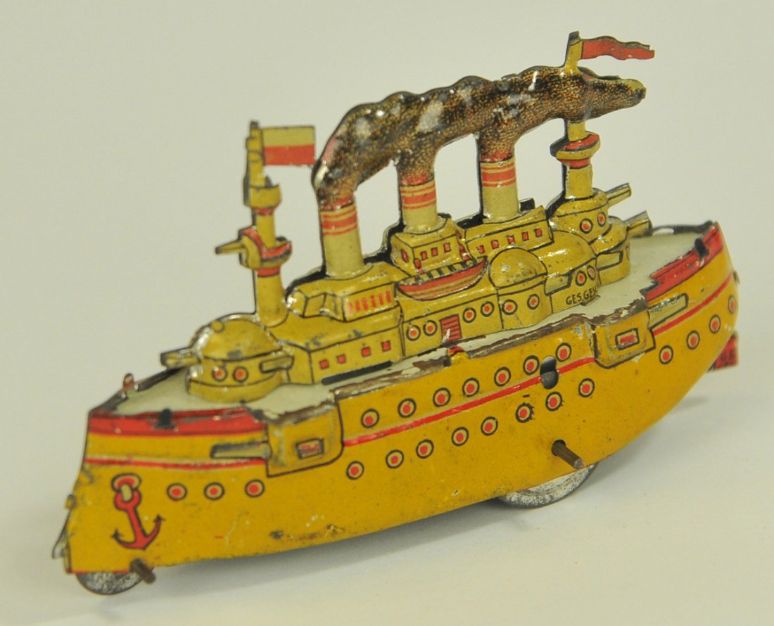 MEIER PENNY TOY BATTLESHIP: Germany, lithographed tin, depicts a four funnel ship with guns on board and stamping, features smoke from all funnels. 4" long.