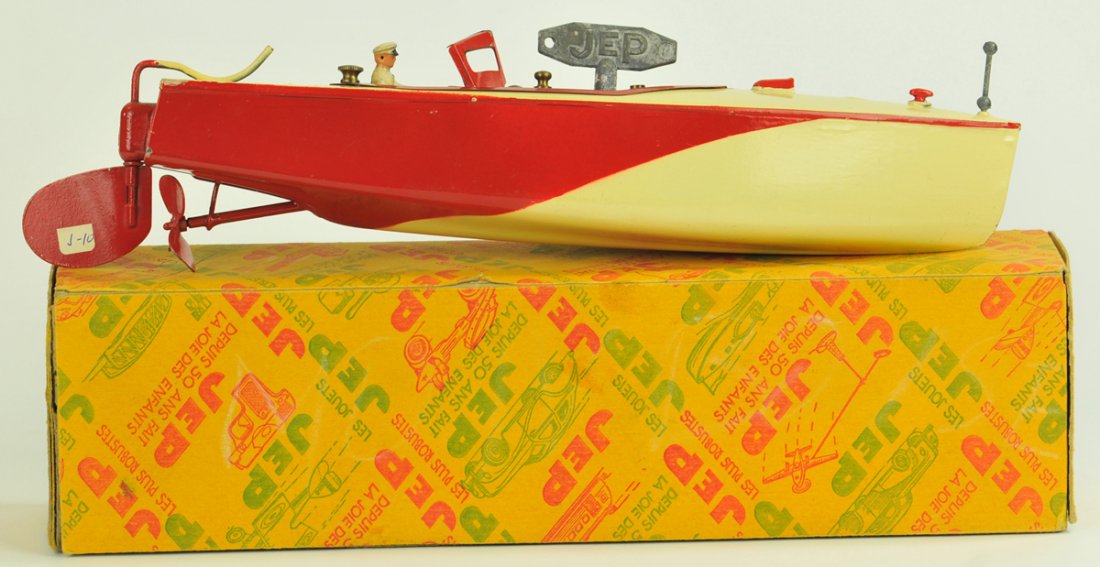 JEP SPEEDBOAT "RUBAN BLEU NO. O": France, c.1930's, boxed example pressed steel, painted in colorful red and cream colors, seated composition figure, clockwork wind from center deck, full appointments, very sleek lines. 12" long.
