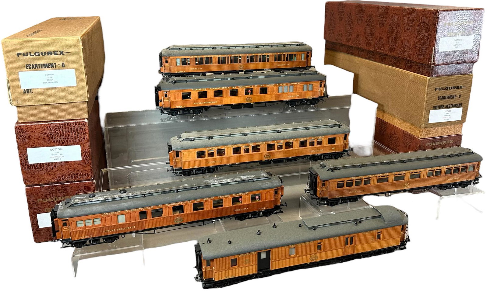 BOXED FULGEREX TEAK PASSENGER CARS: 102. BOXED FULGEREX TEAK PASSENGER CARS | 0 gauge. | 17.5" l. | Some wear to roof of two cars, otherwise (Near Mint Condition) | $700 - $1,400