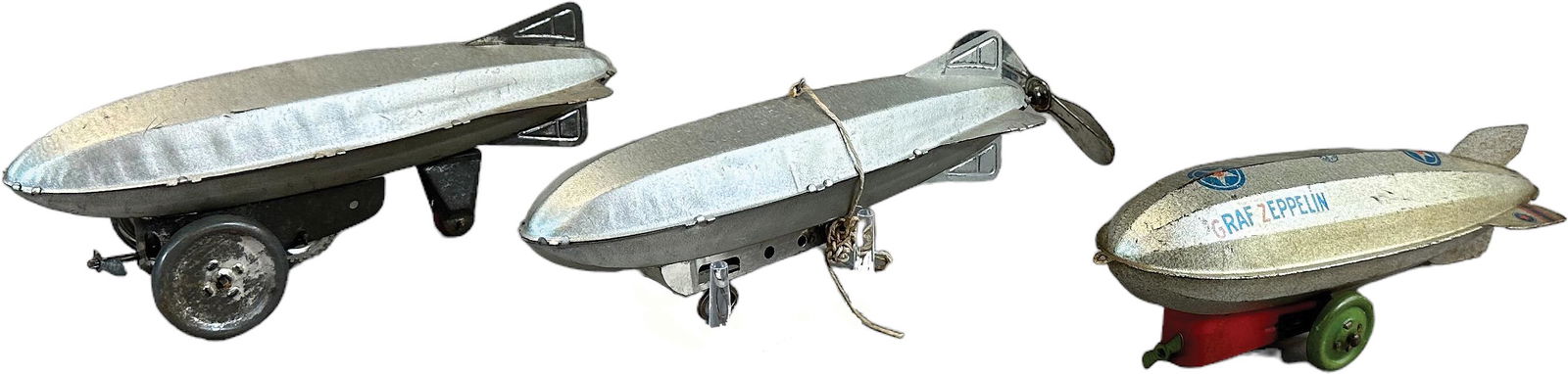 THREE TIN MARX ZEPPELIN DIRIGIBLE VARIATIONS (1 of 5)