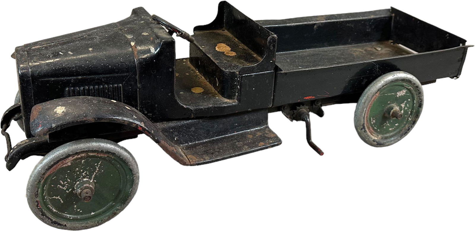 BUDDY L HAND CRANK DUMP: 430. BUDDY L HAND CRANK DUMP | 24" 'l. | Red truck has been overpainted black at some time in history, likely by a child, and may be worth removing to bring back to original red. | $150 - $300