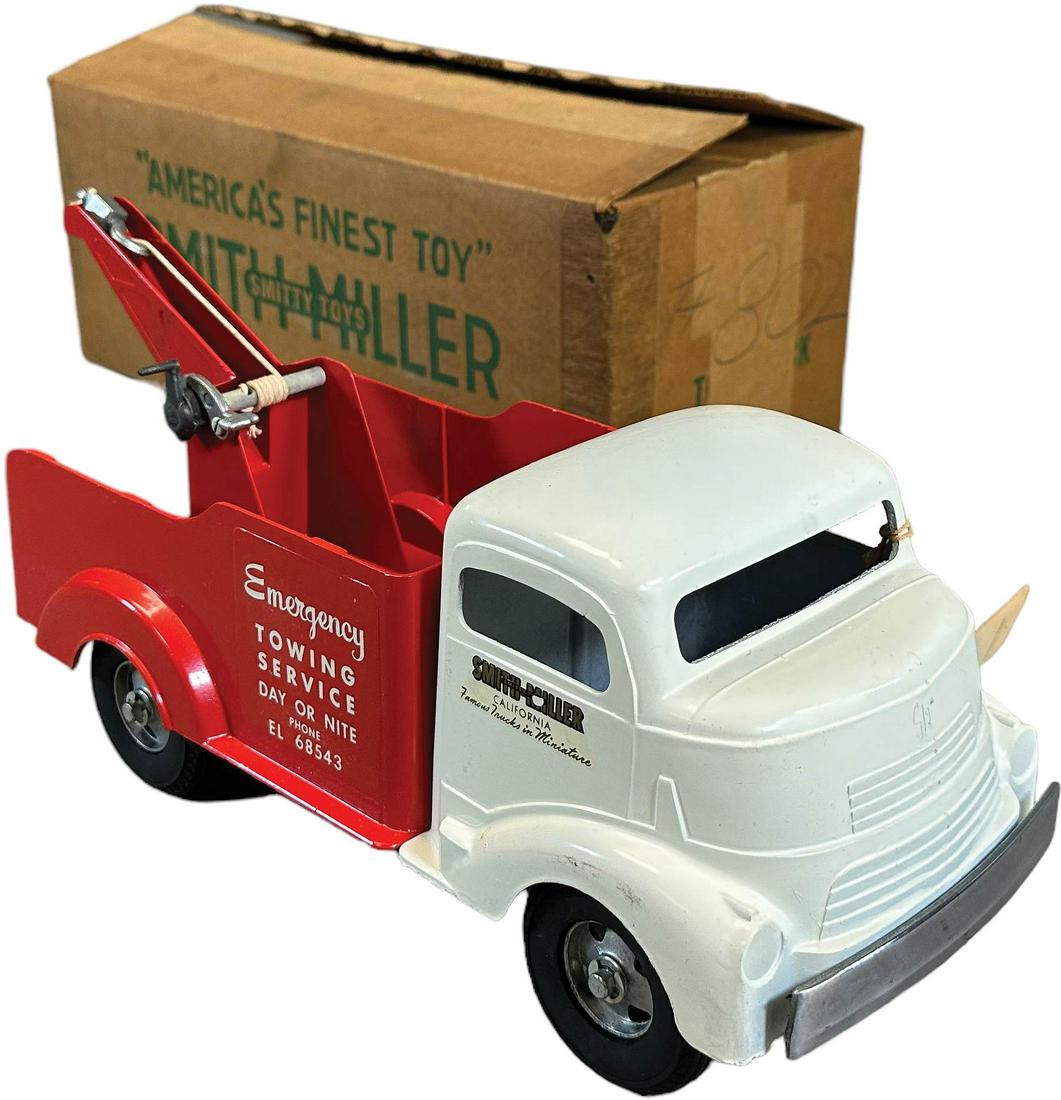 BOXED SMITH MILLER EMERGENCY TOW TRUCK: 490. BOXED SMITH MILLER EMERGENCY TOW TRUCK | 13" l. | Old store stuck, not played with (Near Mint Condition) | $250 - $500