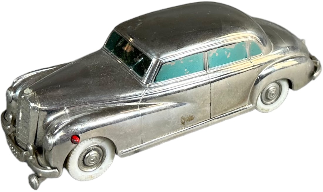 GERMAN PRAMETA MERCEDES BENZ 300 WIND-UP CAR: 8. GERMAN PRAMETA MERCEDES BENZ 300 WIND-UP CAR | Marked Brit. Zone Germany, Prameta Kolner Automodelle on bottom. | 5" l. | (Excellent Condition) | $150 - $300