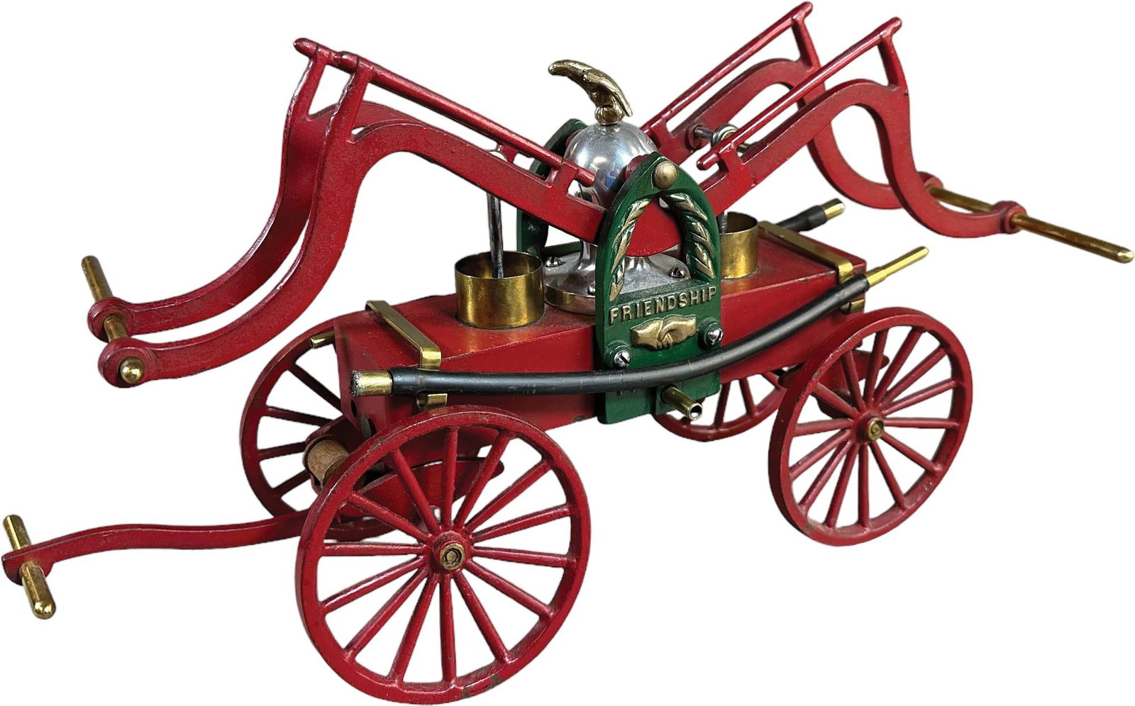 FRIENDSHIP 1774 FIRE PUMPER: 166. FRIENDSHIP 1774 FIRE PUMPER | Clark Ship Model Co., Philadelphia, made circa 1930, modeled after the early side cylinder pumpers of the 1800's. | 15" l. | (Pristine Condition) | $500 - $1,000