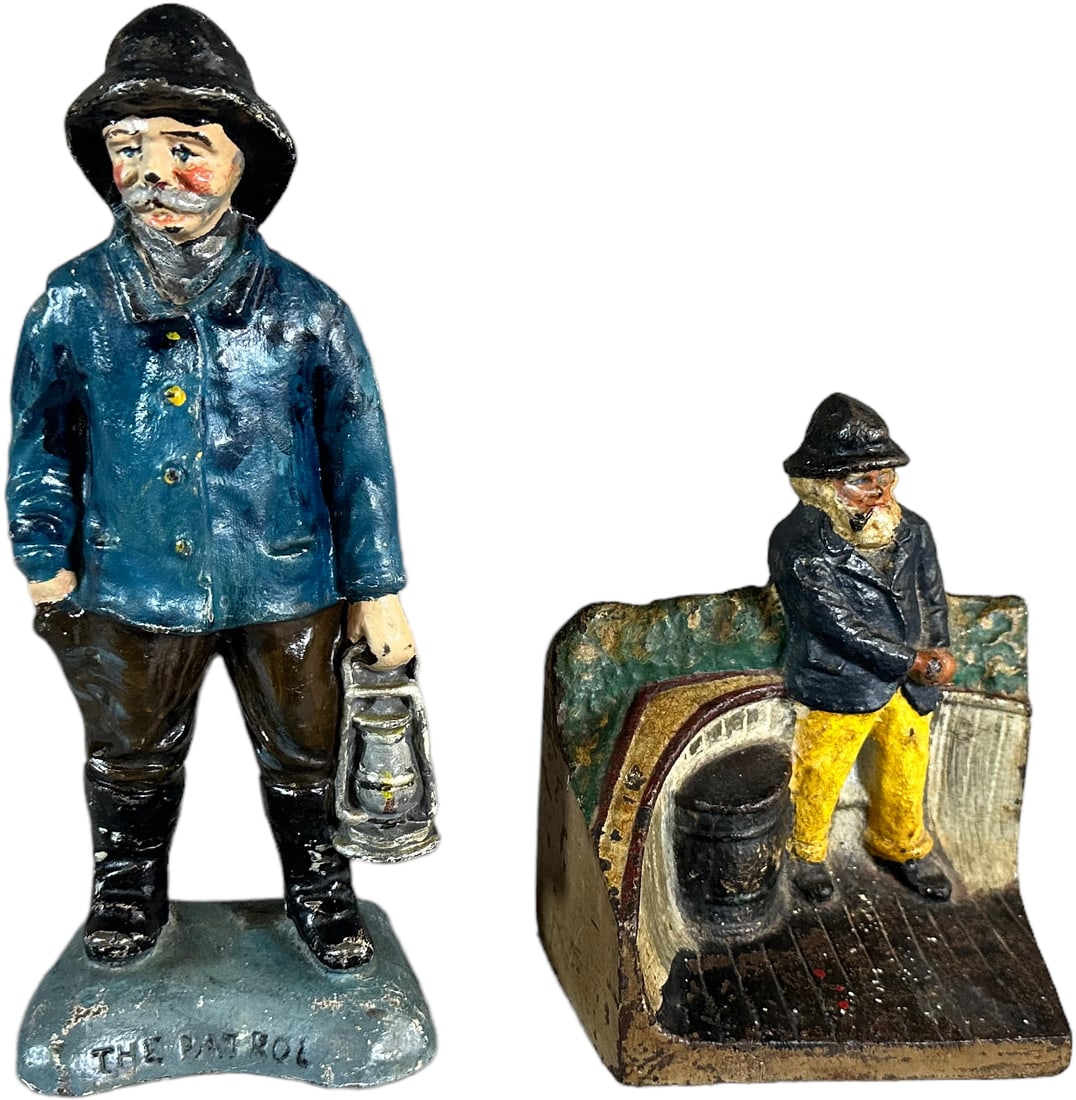 THE PATROL AND OLD SALT AT DOCK DOORSTOPS: 1282. THE PATROL AND OLD SALT AT DOCK DOORSTOPS | Full figure "The Patrol" marked on front & " L. Renier Novelty". Great paint. And unusual Old Salt by dock. | 8.75" h. | (Excellent to Pristine Condit