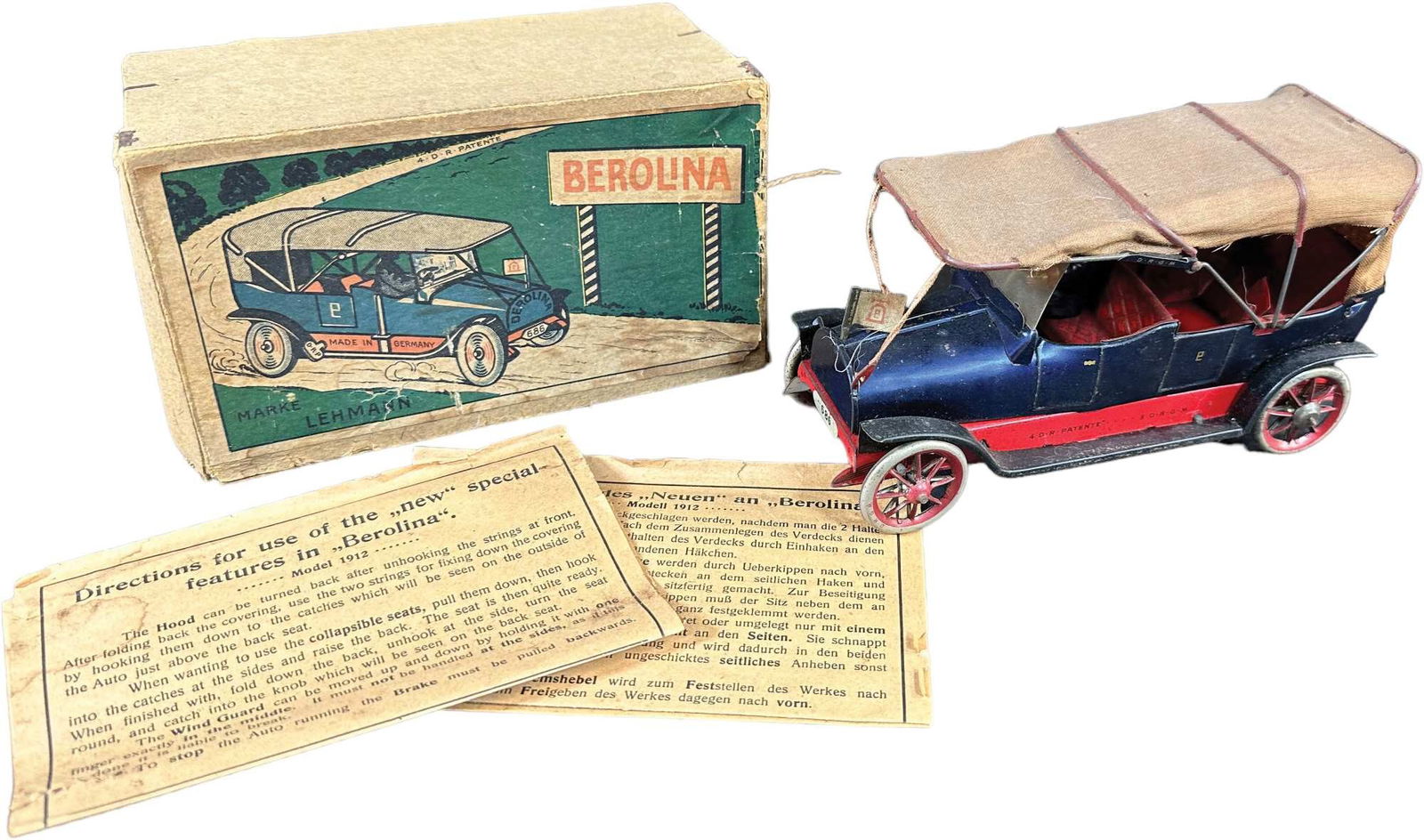 BOXED LEHMANN BEROLINA: 117. BOXED LEHMANN BEROLINA | Very rare box which seldom comes to market, with two instruction sheets. | 6.5" l. | Old tape reinforcement on three corners inside of box lid, toy in (Pristine Condition