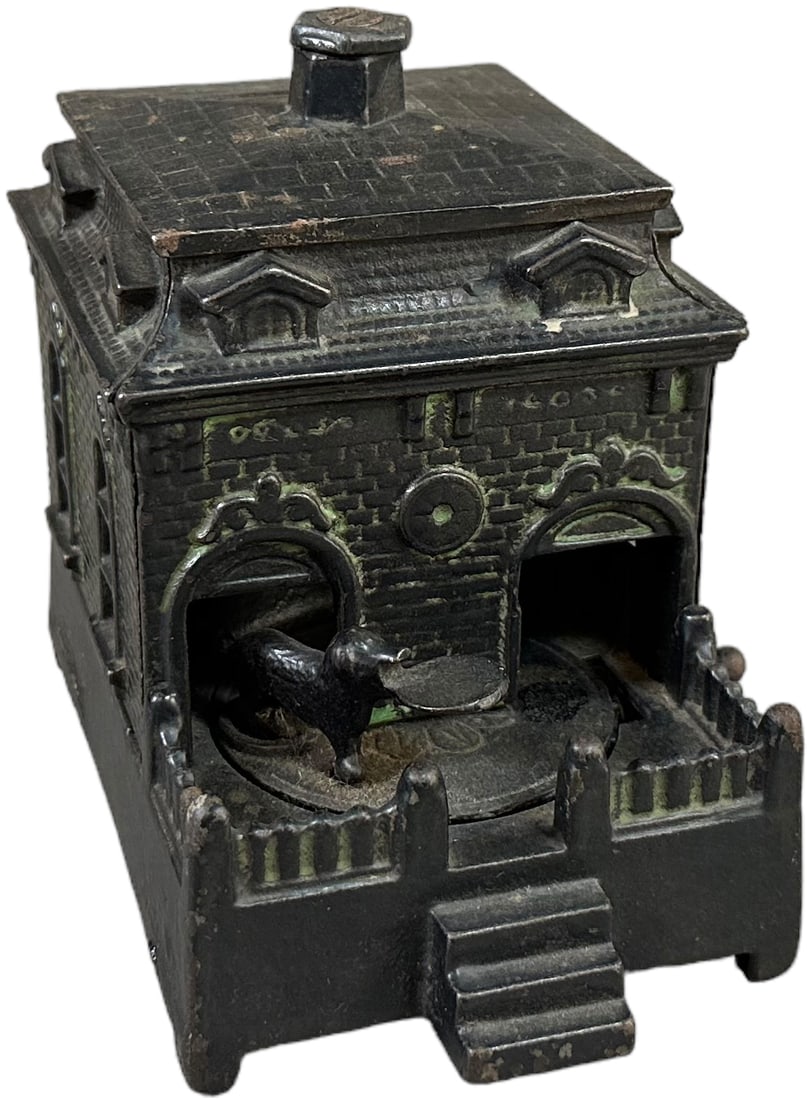 DOG ON TURNTABLE MECHANICAL BANK: 1341. DOG ON TURNTABLE MECHANICAL BANK | Judd Mfg. Co. | 4.5" h. | (Excellent Condition) | $300 - $600