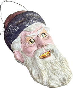 GERMAN SANTA HEAD LANTERN: 68. GERMAN SANTA HEAD LANTERN | Nice molding and large size, very expressive face. | 8.25" l. | Very slight cracking from age, all original (Pristine to Near Mint Condition) | $1,500 - $2,500