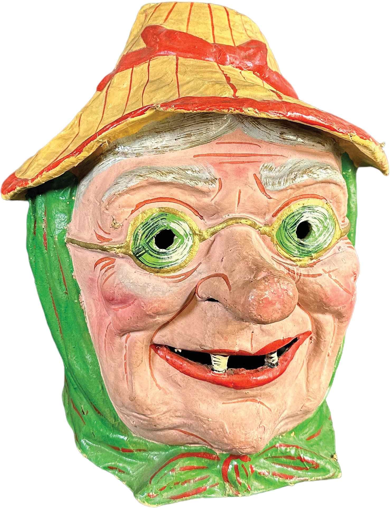 FABULOUS OLD WITCH HEAD PRESSED MASK: 174. FABULOUS OLD WITCH HEAD PRESSED MASK | Full head mask with amusing large nose and a two-tooth grin. | 15" h. | Typical wear from age, especially at edges, all original in (Excellent Condition) | 