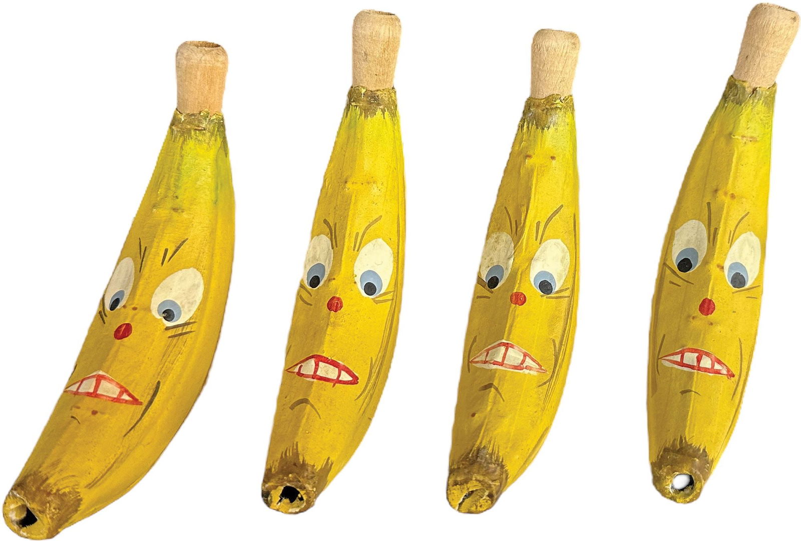 FOUR SMALL GERMAN BANANA PARTY HORNS: 192. FOUR SMALL GERMAN BANANA PARTY HORNS | 6" l. | (Pristine Condition) | $200 - $400