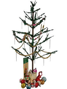 VINTAGE ROUND BASE FEATHER TREE: 203. VINTAGE ROUND BASE FEATHER TREE | Some candle holders still present, includes box of over 55 Post-War glass ornaments including garland strings and icicles. | 48" h. | Some feather loss to branch