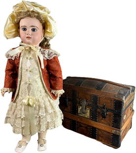 LARGE JUMEAU DOLL W/ ACCESSORIES TRUNK: 291. LARGE JUMEAU DOLL W/ ACCESSORIES TRUNK | A rare find! Beautiful Jumeau doll with original clothing. Trunk contains trousseau of original shoes, clothing, and accessories. | 30" h. | Hairline crac