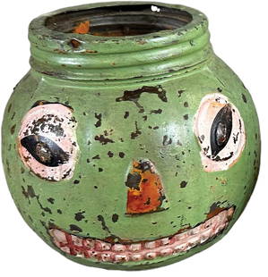 GLASS JACK-O-LANTERN CANDY CONTAINER: 453. GLASS JACK-O-LANTERN CANDY CONTAINER | Original paint in rare green example. | 4" h. | Missing metal wire handle, original paint in (Excellent Condition) | $400 - $600
