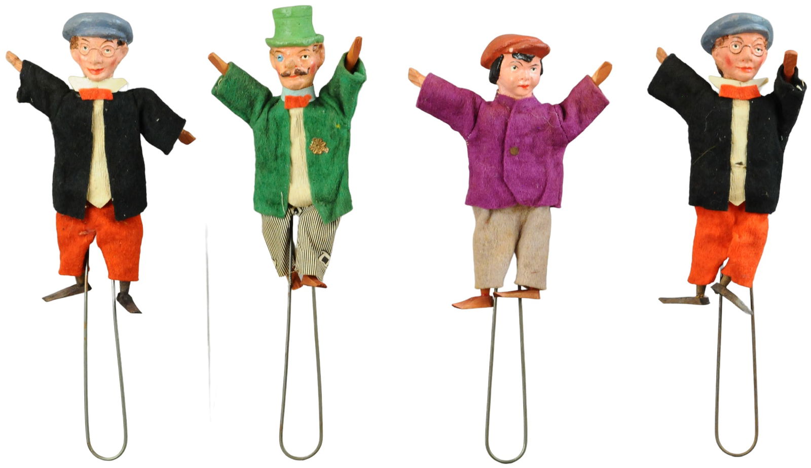 FOUR HAND-HELD FIGURAL NOISEMAKERS (1 of 2)