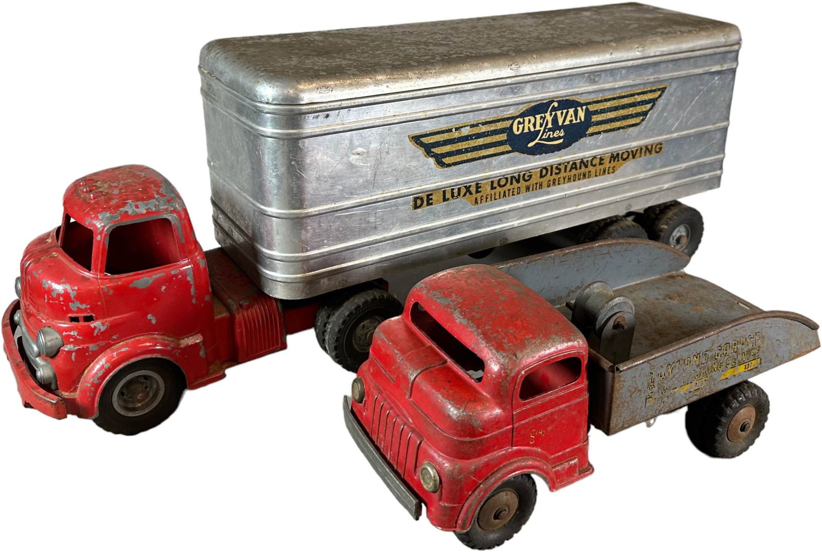 GREY VAN MOVING AND TOYLAND WRECKER TRUCKS: 625. GREY VAN MOVING AND TOYLAND WRECKER TRUCKS | 24" l. | (Very Good Condition) | $150 - $300