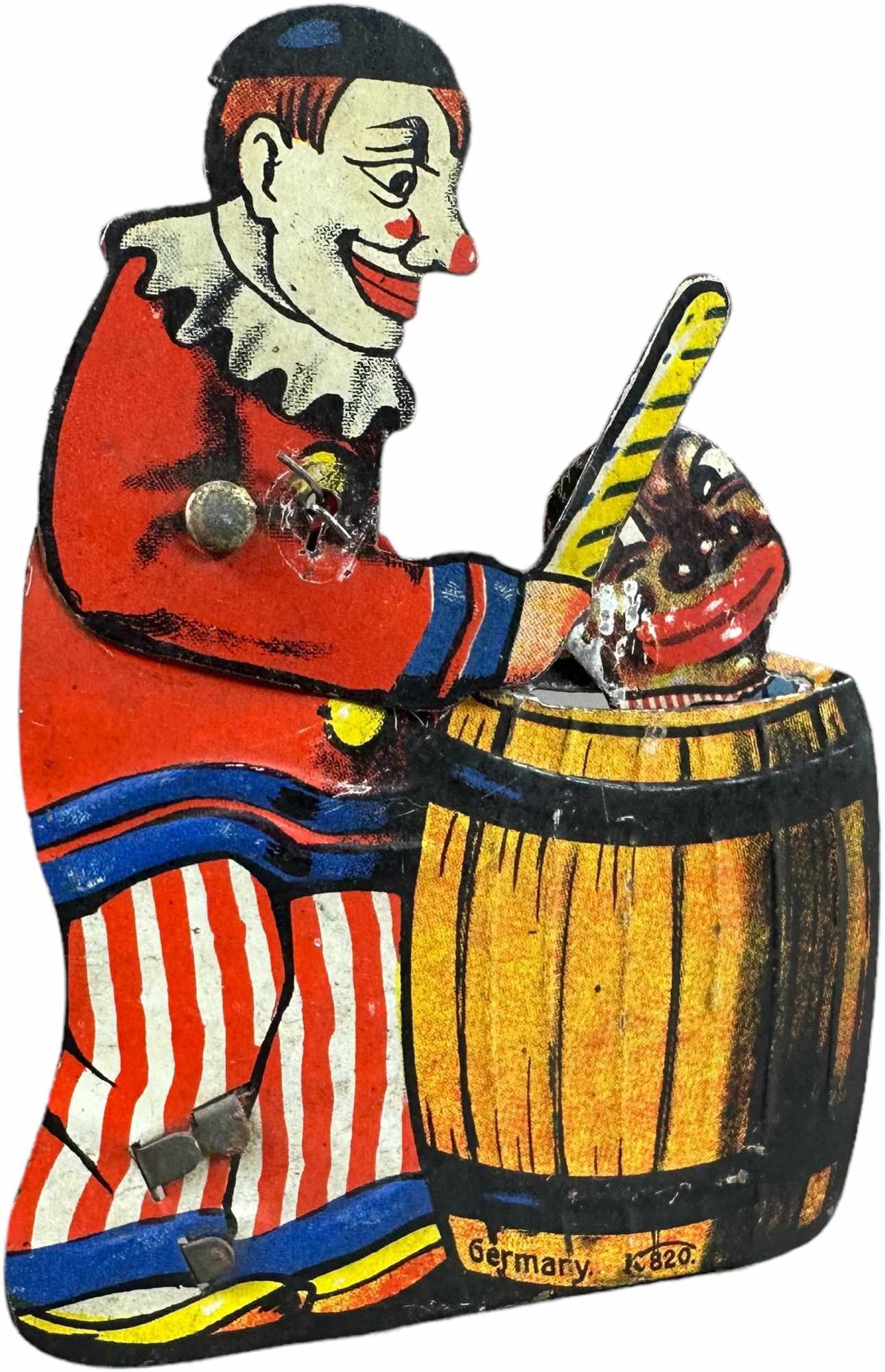 GERMAN CLOWN AND BOY IN BARREL HAND CLICKER: 66. GERMAN CLOWN AND BOY IN BARREL HAND CLICKER | 4.5" h. | Wire at arm added, litho in (Excellent Condition) | $100 - $200