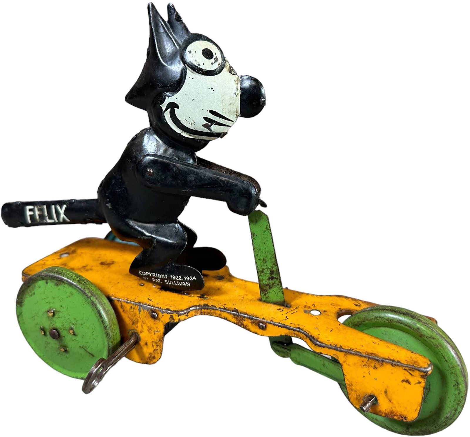GUNTHERMANN FELIX THE CAT SCOOTER: 295. GUNTHERMANN FELIX THE CAT SCOOTER | Germany, wind-up. | 7.5? l. | Some typical black overpaint to cat, (Very Good Condition) | $200 - $400