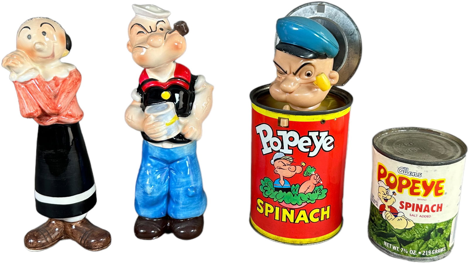 MATTEL POPEYE TOY AND OTHER POPEYE ITEMS: 354. MATTEL POPEYE TOY AND OTHER POPEYE ITEMS | Mattel Popeye toy, Allen's spinach can, and Japanese porcelain salt and pepper shakers. | 7.5" h. | (Very Good to Excellent Condition) | $150 - $300