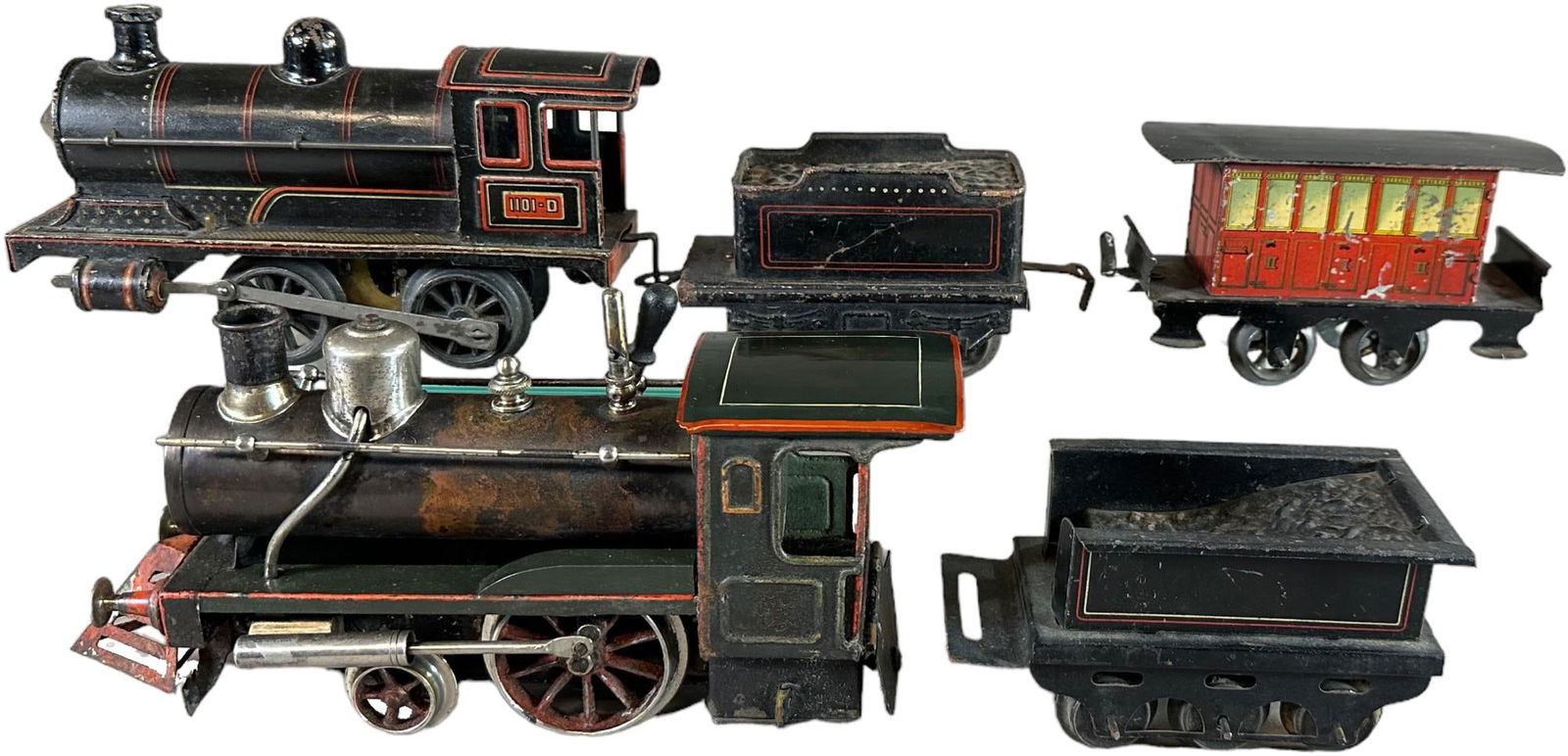 CARETTE LOCOMOTIVES AND ISSMAYER COACH: 462. CARETTE LOCOMOTIVES AND ISSMAYER COACH | Litho is electric, stork leg is live steam, both 0 gauge. | 8.5" l. Loco | Stork leg has repainted roof and splashers and incorrect Bing tender, overall (