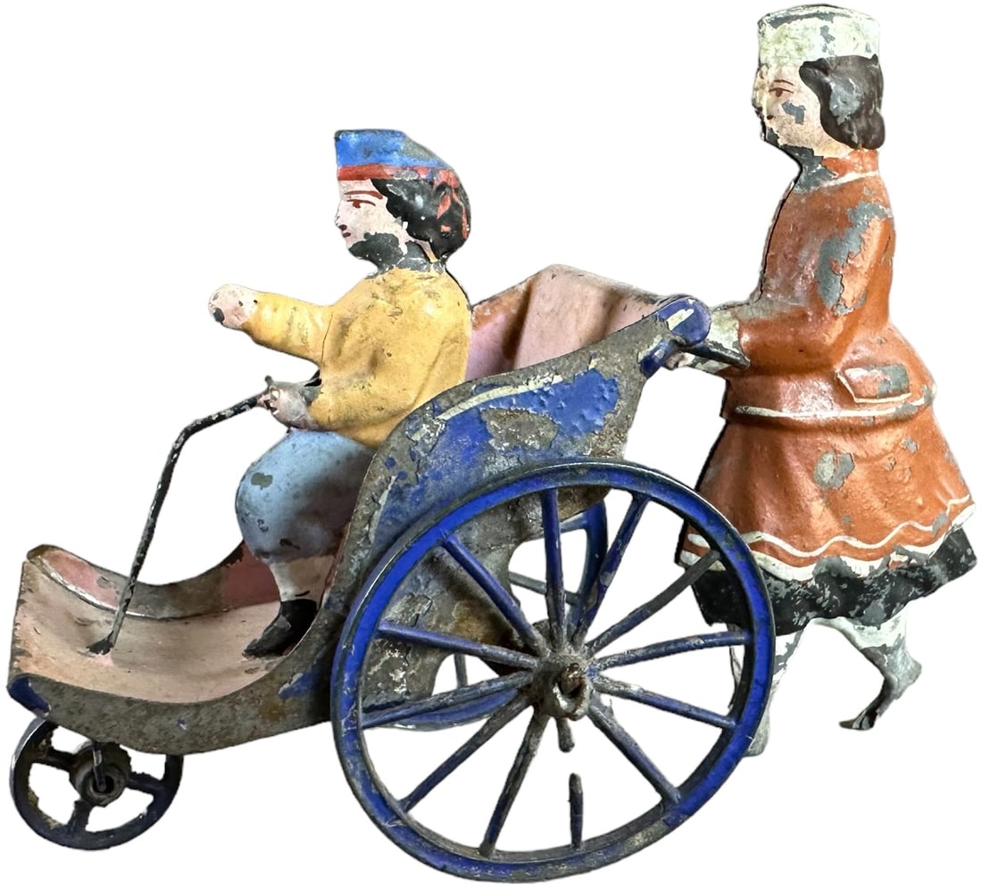 FRENCH NANNY PUSHING CHILD IN PRAM (1 of 3)