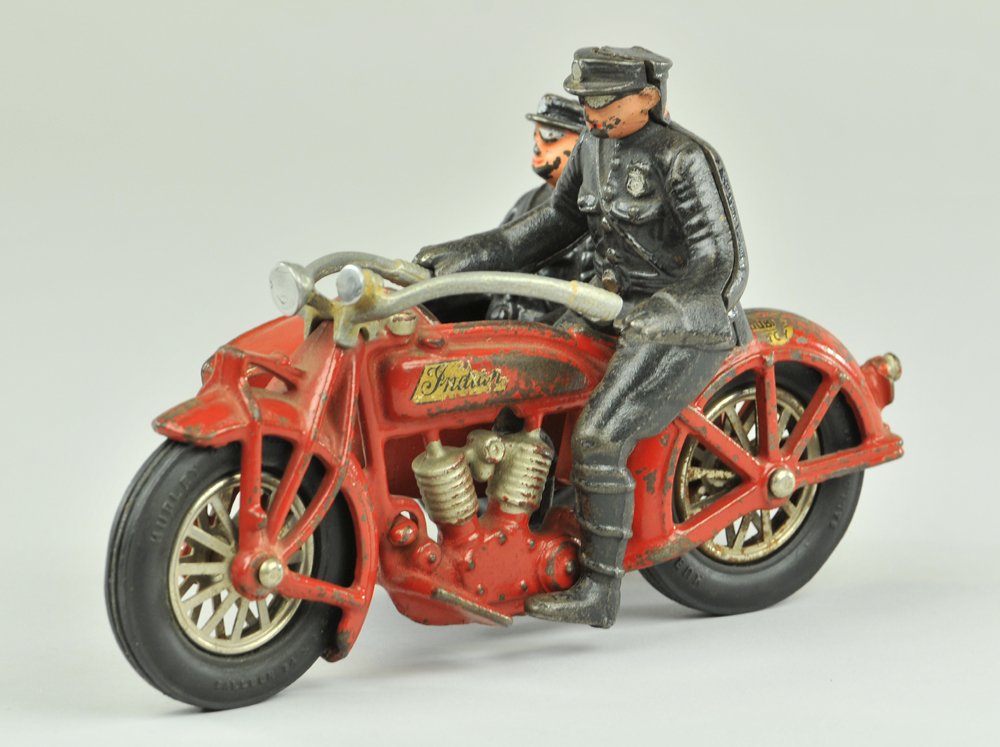 HUBLEY INDIAN MOTORCYCLE WITH SIDE CAR: Indian model, cast iron, painted in red overall, two original riders, aluminum handle bars, rubber tires, spoke wheels, decal on side. Partial Hubley decal on rear fender. 8 1/2" l.