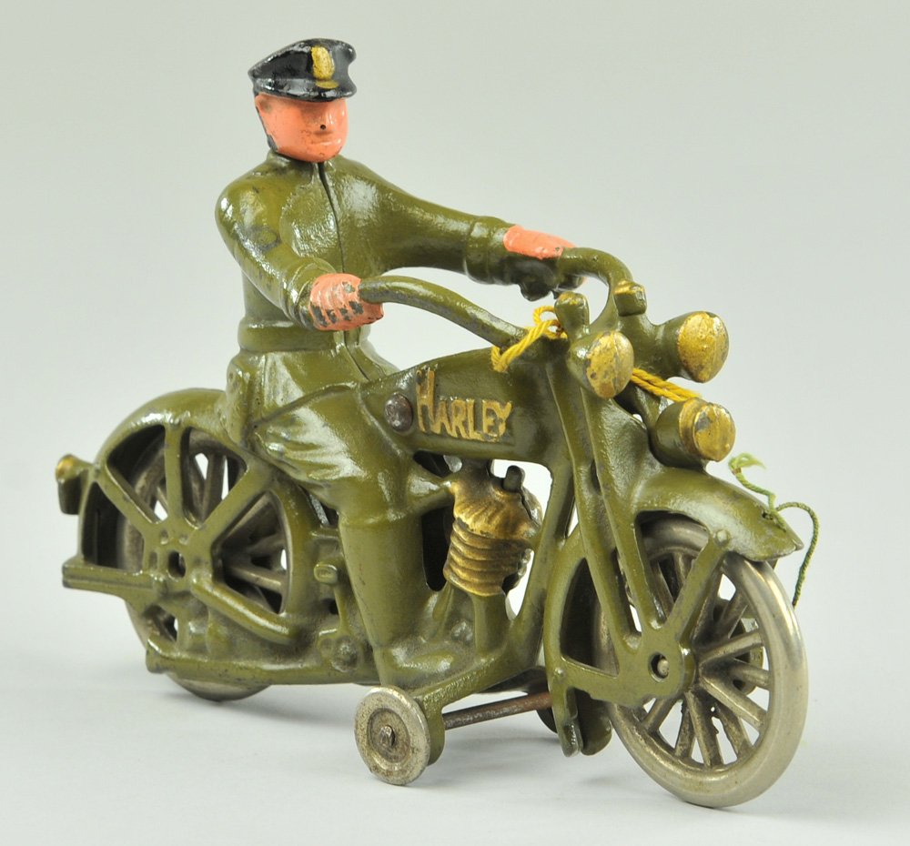 HUBLEY HARLEY DAVIDSON MOTORCYCLE: Cast iron, swivel head version, depicts cast cop driver on olive green Harley, name embossed on engine sides, nickel plated cast iron spoke wheels. 7" l.