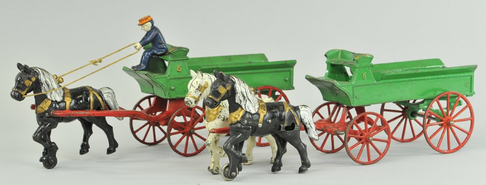 LOT OF TWO KENTON DRAY WAGONS: Includes solo and two team horse drawn examples, open green beds, red spoke wheels, one driver. 14 1/2" l.