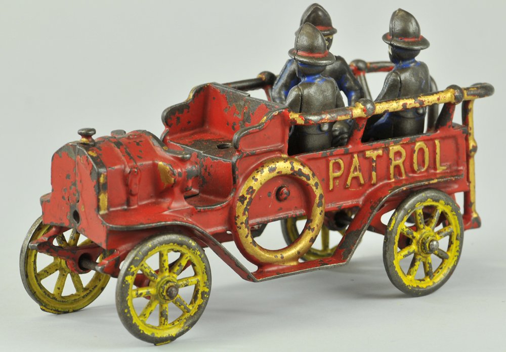 KENTON PATROL WAGON: Kenton, cast iron, painted in red overall, railed open body w/bench seating and three firemen, yellow painted spoke wheels. 9" l.